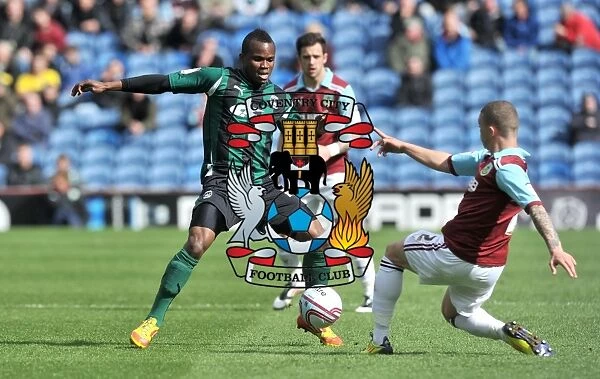 Battling for Control: Nimely vs. Trippier in the Intense Npower Championship Clash between Coventry City and Burnley (April 2012)