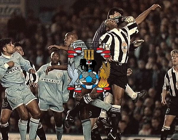 Les Ferdinand Leaps for the Ball: Coventry City vs. Newcastle United