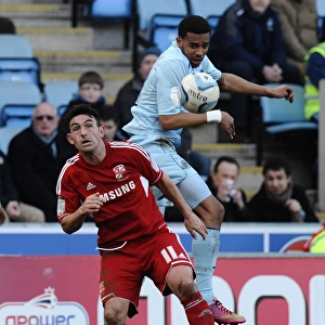 Cyrus Christie Wins the Ball: Coventry City vs Swindon Town in Npower League One at Ricoh Arena