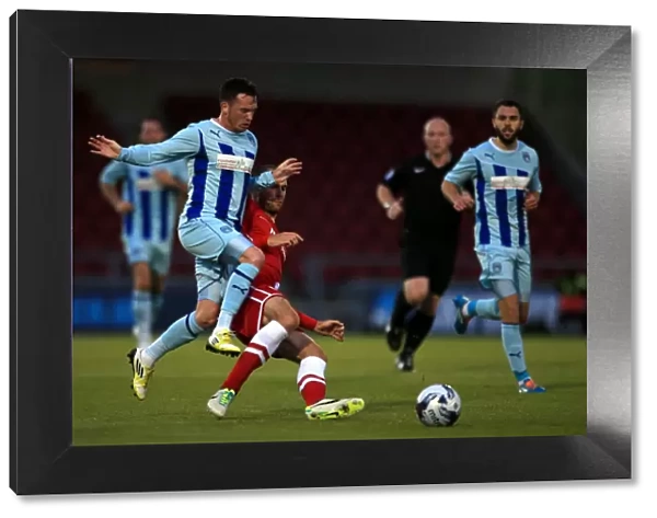 Battle for the Ball: Coventry City vs. Cardiff City in the Capital One Cup