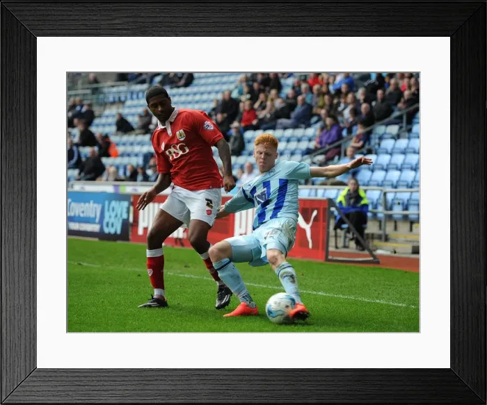 Framed Print : Clash at Ricoh Arena: Haynes vs. Little in Coventry City vs. Bristol City Match