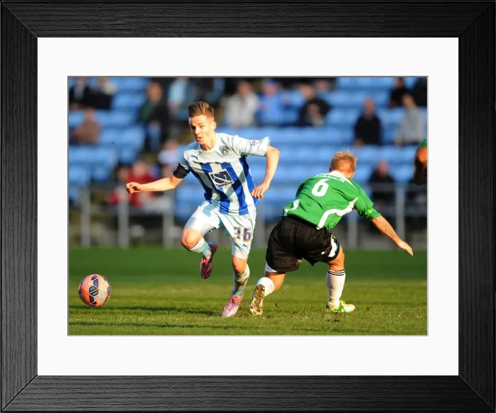 Framed Print : Battle for the Ball: Coventry City vs. Worcester City in FA Cup First Round - James Maddison vs. Danny Jackman Framed Print : Battle for the Ball: Coventry City vs. Worcester City in FA Cup First Round - James Maddison vs. Danny Jackman