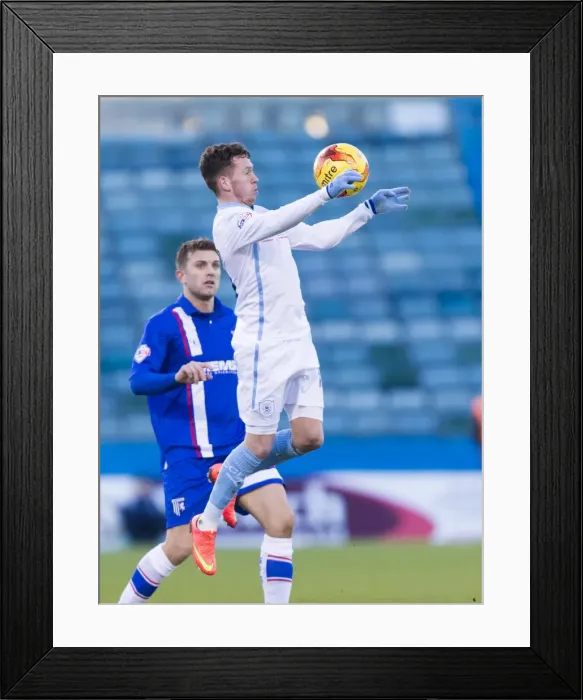 Framed Print : Danny Swanson vs Doug Loft: A Battle in the League One Clash at Priestfield Stadium Framed Print : Danny Swanson vs Doug Loft: A Battle in the League One Clash at Priestfield Stadium