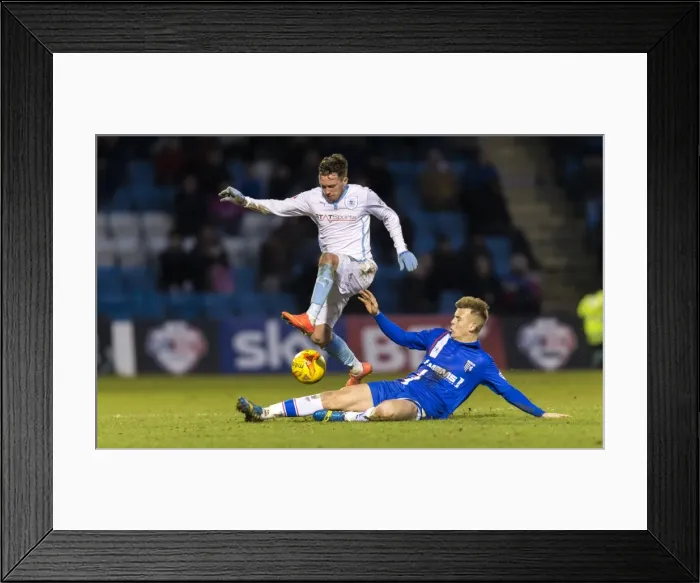 Framed Print : Leap of Determination: Danny Swanson Evasions Jake Hessenthaler in Coventry's League One Battle Framed Print : Leap of Determination: Danny Swanson Evasions Jake Hessenthaler in Coventry's League One Battle