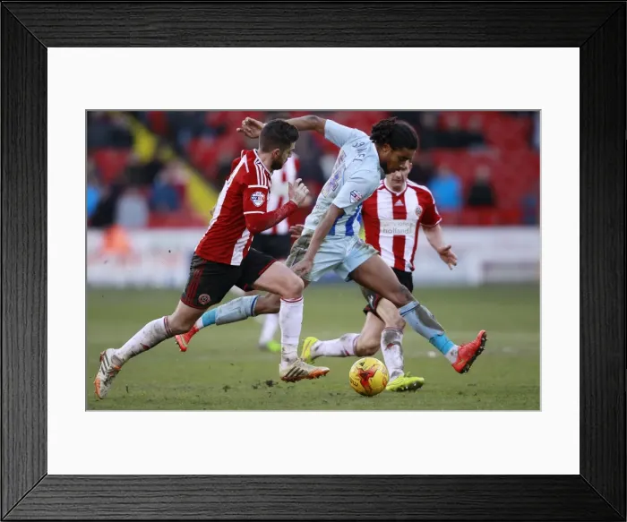Framed Print : Battling for Control: Harris vs. Samuel - Sheffield United vs. Coventry City Football Rivalry Framed Print : Battling for Control: Harris vs. Samuel - Sheffield United vs. Coventry City Football Rivalry