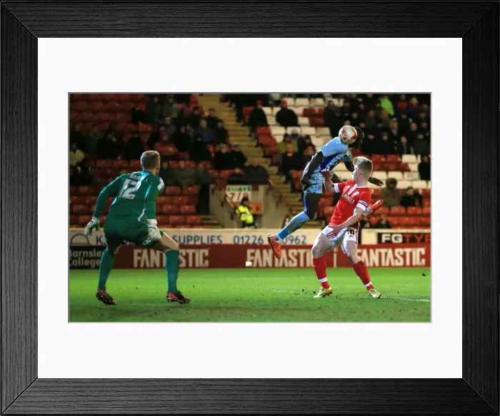 Framed Print : Sanmi Odelusi's Thrilling Header: Coventry City vs Barnsley in Sky Bet League One Framed Print : Sanmi Odelusi's Thrilling Header: Coventry City vs Barnsley in Sky Bet League One