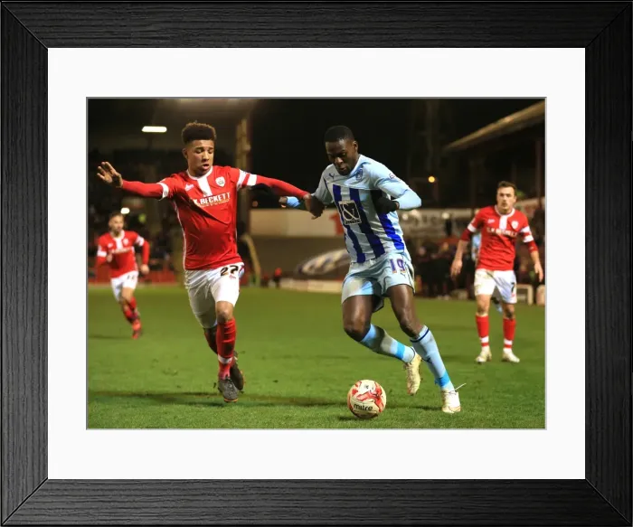 Framed Print : Battling for Control: Holgate vs. Nouble in Sky Bet League One Clash at Oakwell Framed Print : Battling for Control: Holgate vs. Nouble in Sky Bet League One Clash at Oakwell