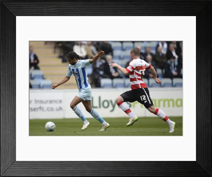 Framed Print : Coventry Citys Dominic Samuel scores the opening goal against Doncaster Rovers Framed Print : Coventry Citys Dominic Samuel scores the opening goal against Doncaster Rovers