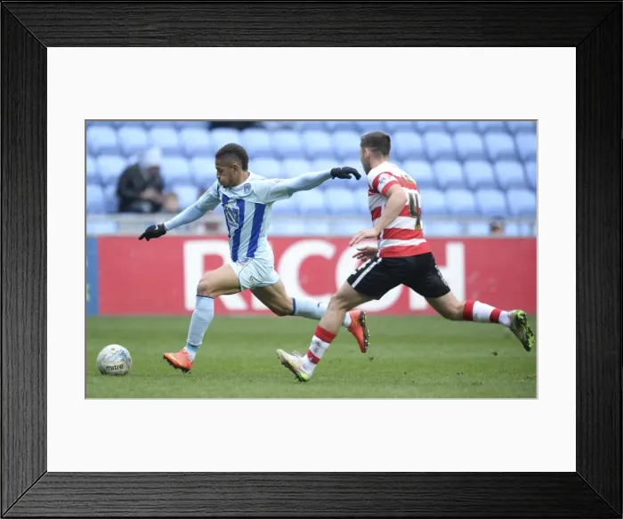 Framed Print : Determined Simeon Jackson: Coventry City's Brilliant Shot Amidst Doncaster Rovers Defensive Pressure (Sky Bet League One) Framed Print : Determined Simeon Jackson: Coventry City's Brilliant Shot Amidst Doncaster Rovers Defensive Pressure (Sky Bet League One)