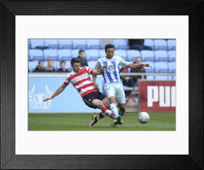 Framed Print : Intense Rivalry: Enda Stevens vs Grant Ward Clash in Coventry City vs Doncaster Rovers League One Match