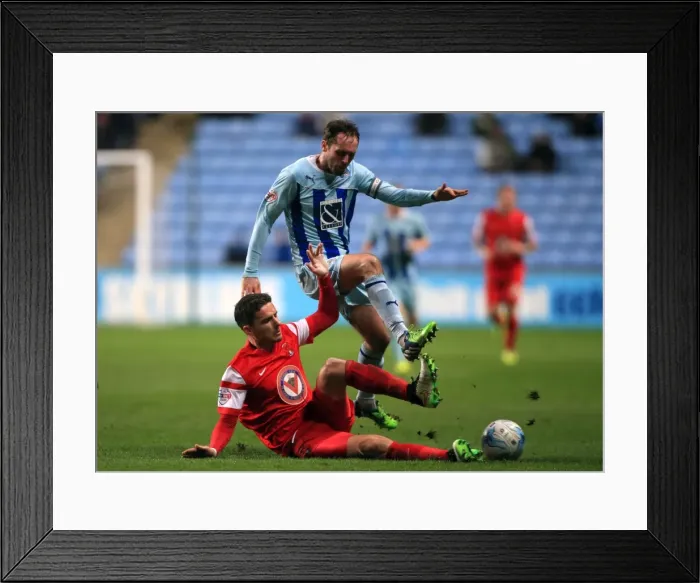 Framed Print : Intense Battle: Jim O'Brien vs Mathieu Baudry in Sky Bet League One Clash Framed Print : Intense Battle: Jim O'Brien vs Mathieu Baudry in Sky Bet League One Clash