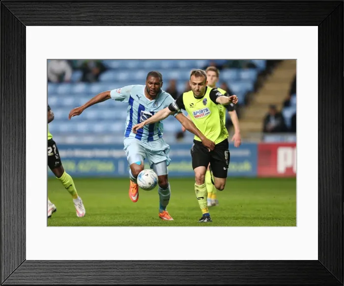 Framed Print : Reda Johnson vs. Liam Kelly: A Fierce Rivalry Unfolds in Coventry City's Sky Bet League One Clash against Oldham Athletic Framed Print : Reda Johnson vs. Liam Kelly: A Fierce Rivalry Unfolds in Coventry City's Sky Bet League One Clash against Oldham Athletic