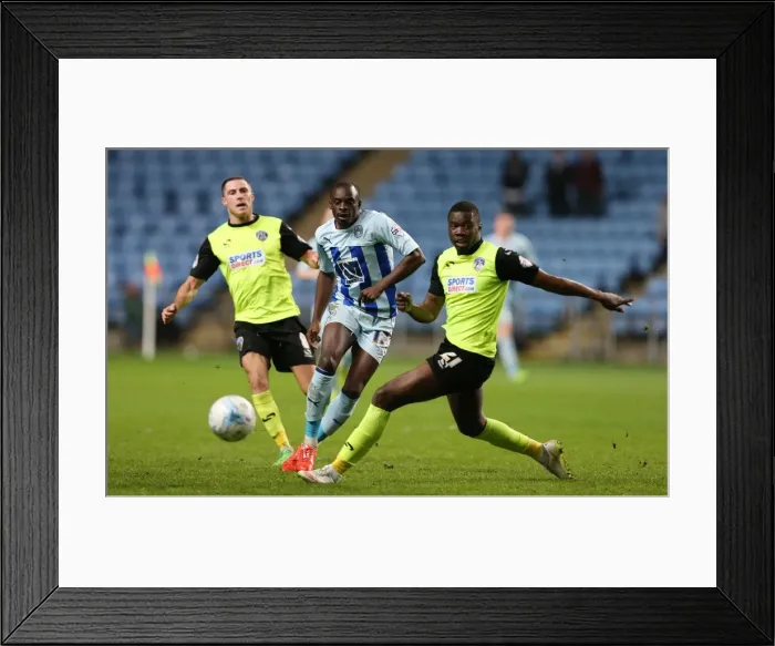 Framed Print : Clash at Ricoh Arena: Sanmi Odelusi vs Genserix Kusunga - Sky Bet League One Showdown Framed Print : Clash at Ricoh Arena: Sanmi Odelusi vs Genserix Kusunga - Sky Bet League One Showdown