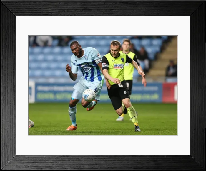 Framed Print : Reda Johnson vs. Liam Kelly: A Riveting Showdown in Coventry City's Sky Bet League One Match Against Oldham Athletic