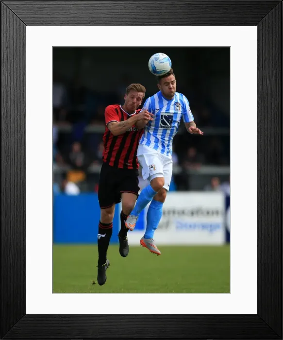 Framed Print : Intense Header Battle: Armstrong vs Mullins in Coventry City's Pre-Season Clash with Oxford United Framed Print : Intense Header Battle: Armstrong vs Mullins in Coventry City's Pre-Season Clash with Oxford United