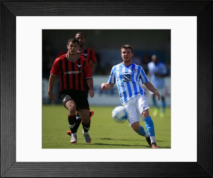 Framed Print : Chris Stokes vs Patrick Hoban: A Riveting Clash at Coventry City's Liberty Way Stadium - Coventry City vs Oxford United Pre-Season Friendly Framed Print : Chris Stokes vs Patrick Hoban: A Riveting Clash at Coventry City's Liberty Way Stadium - Coventry City vs Oxford United Pre-Season Friendly