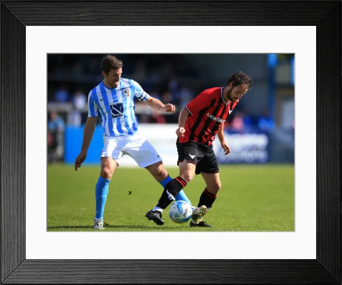 Framed Print : Sam Ricketts vs Danny Hylton: A Battle for the Ball - Coventry City vs Oxford United (Pre-Season Friendly)