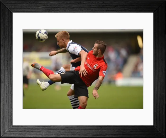 Framed Print : Battle for the Ball: Webster vs. Armstrong - Intense Rivalry in Sky Bet League One: Millwall vs. Coventry City Framed Print : Battle for the Ball: Webster vs. Armstrong - Intense Rivalry in Sky Bet League One: Millwall vs. Coventry City
