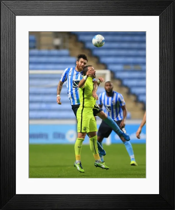 Framed Print : Battle for the Ball: Vincelot vs. Hunt in Sky Bet League One Clash