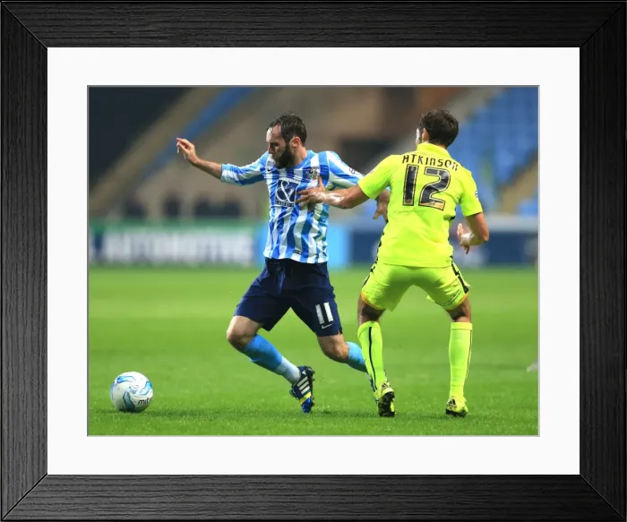 Framed Print : Coventry Citys Jim O Brien (left) and Southend Uniteds Will Atkinson battle for the ball