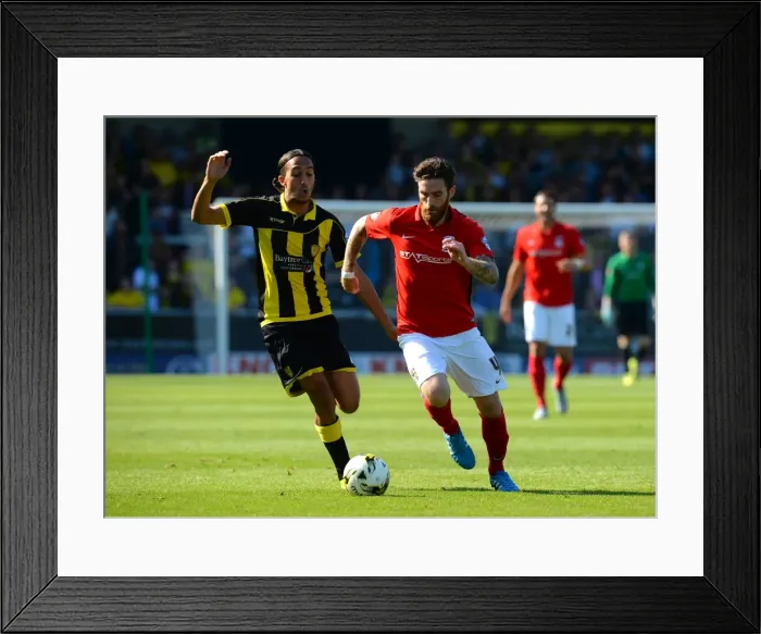 Framed Print : Clash at Pirelli Stadium: A Battle Between Nasser El Khayati and Romain Vincelot in Sky Bet League One Framed Print : Clash at Pirelli Stadium: A Battle Between Nasser El Khayati and Romain Vincelot in Sky Bet League One