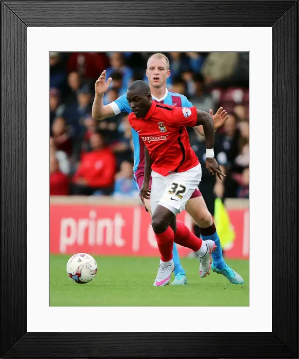 Framed Print : Marc-Antoine Fortune vs Neal Bishop: Coventry City's Gritty Battle in Sky Bet League One Framed Print : Marc-Antoine Fortune vs Neal Bishop: Coventry City's Gritty Battle in Sky Bet League One
