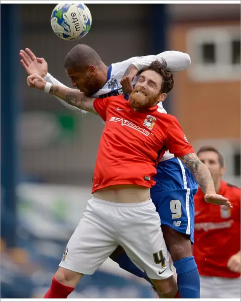 Clash at Gigg Lane: A Battle Between Leon Clarke and Romain Vincelot in Sky Bet League One