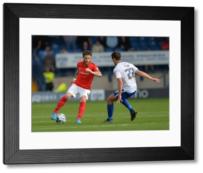 Framed Print : Clash on the Pitch: A Sky Bet League One Battle between Romain Vincelot and Danny Pugh at Gigg Lane Framed Print : Clash on the Pitch: A Sky Bet League One Battle between Romain Vincelot and Danny Pugh at Gigg Lane