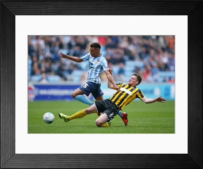 Framed Print : Jacob Murphy Evades Matt Tootle in Sky Bet League One Showdown at Ricoh Arena
