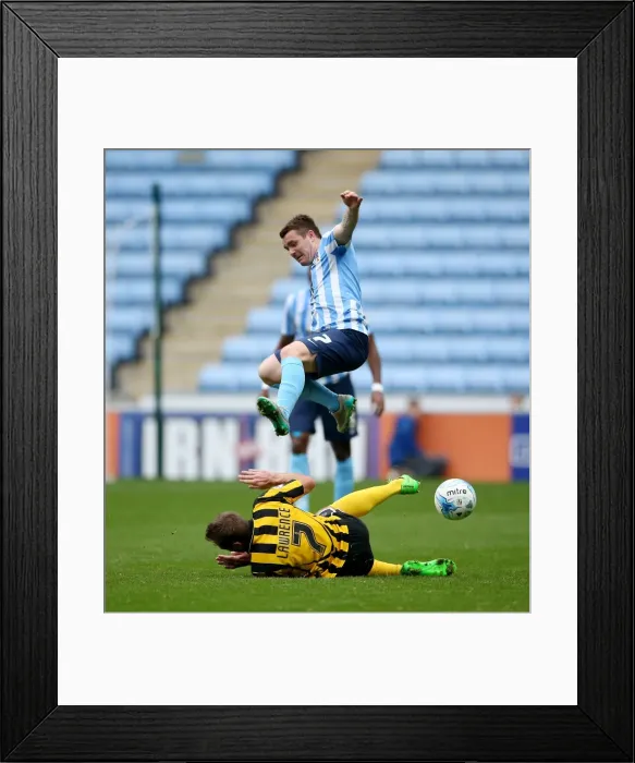 Framed Print : John Fleck Defies Gravity: Soaring Over Liam Lawrence's Tackle in Coventry City's Victory Framed Print : John Fleck Defies Gravity: Soaring Over Liam Lawrence's Tackle in Coventry City's Victory