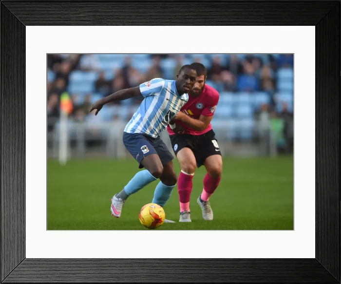 Framed Print : Battle for the Ball: Fortune vs. Bostwick - Coventry City vs. Peterborough United Rivalry Framed Print : Battle for the Ball: Fortune vs. Bostwick - Coventry City vs. Peterborough United Rivalry