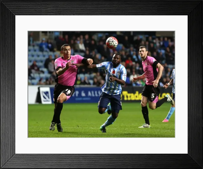 Framed Print : Battle for the Ball: Coventry City vs Northampton Town in the Emirates FA Cup First Round Framed Print : Battle for the Ball: Coventry City vs Northampton Town in the Emirates FA Cup First Round