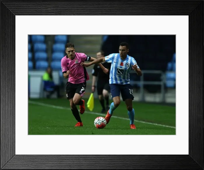 Framed Print : Battle for the Ball: Coventry City vs. Northampton Town - Emirates FA Cup First Round Framed Print : Battle for the Ball: Coventry City vs. Northampton Town - Emirates FA Cup First Round
