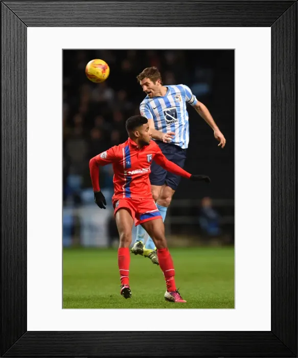 Framed Print : Sam Ricketts Outjumps Dominic Samuel: Coventry City's Aerial Victory vs Gillingham (Sky Bet League One) Framed Print : Sam Ricketts Outjumps Dominic Samuel: Coventry City's Aerial Victory vs Gillingham (Sky Bet League One)