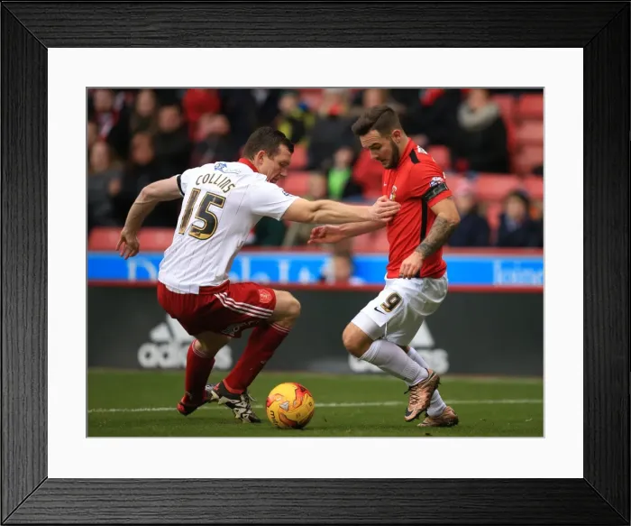 Framed Print : Battling for Control: Neill Collins vs. Adam Armstrong in Sky Bet League One Clash at Bramall Lane Framed Print : Battling for Control: Neill Collins vs. Adam Armstrong in Sky Bet League One Clash at Bramall Lane
