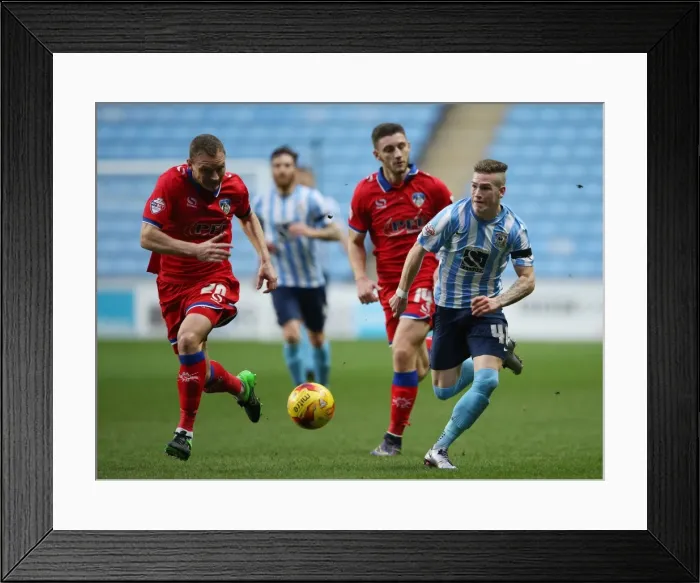 Framed Print : Ryan Kent vs. Brian Wilson: Clash of the Titans in Coventry City vs. Oldham Athletic (Sky Bet League One) Framed Print : Ryan Kent vs. Brian Wilson: Clash of the Titans in Coventry City vs. Oldham Athletic (Sky Bet League One)