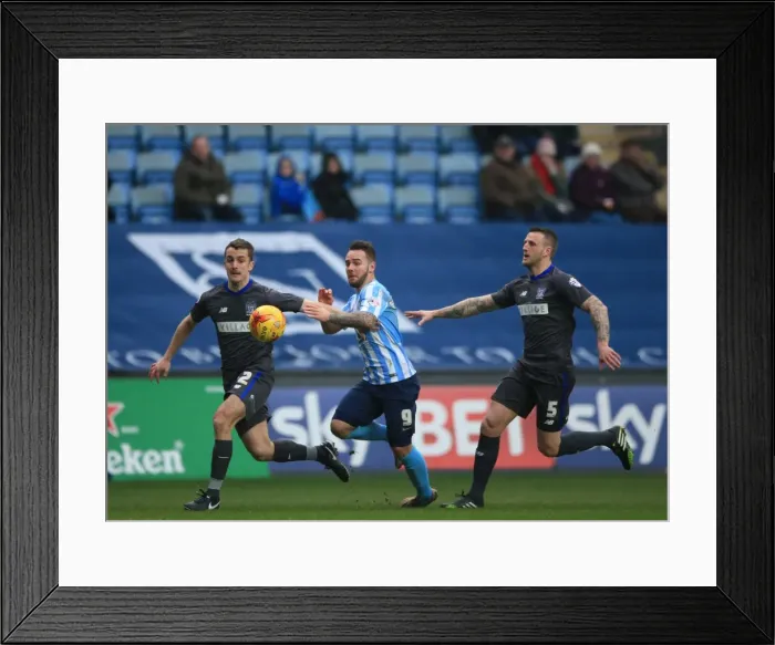 Framed Print : Adam Armstrong Slips Past Bury's Defenders in Coventry City's League One Clash Framed Print : Adam Armstrong Slips Past Bury's Defenders in Coventry City's League One Clash