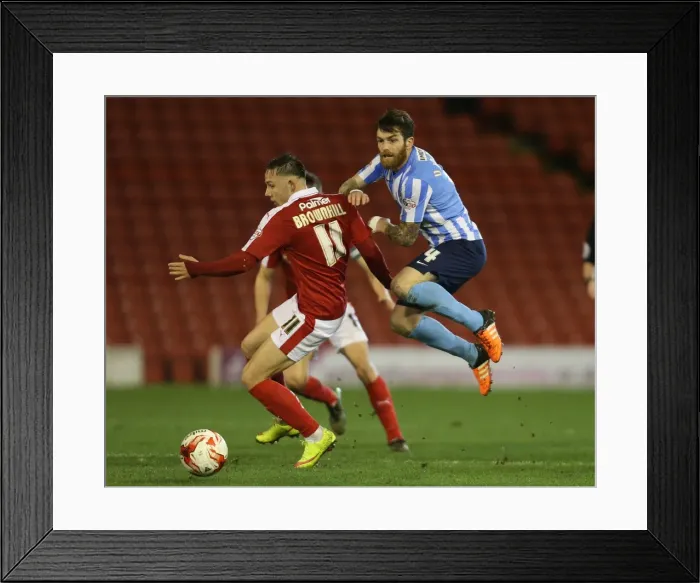 Framed Print : Battleground Oakwell: A Clash of Midfield Titans - Josh Brownhill vs. Romain Vincelot Framed Print : Battleground Oakwell: A Clash of Midfield Titans - Josh Brownhill vs. Romain Vincelot