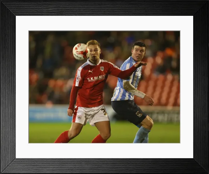 Framed Print : Intense Battle for Possession: Harry Chapman vs Chris Stokes in Sky Bet League One Clash (Barnsley vs Coventry City)