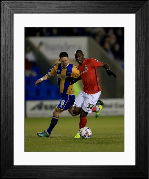 Framed Print : Intense Rivalry: Fortune vs. Blackstone - Sky Bet League One Clash at Greenhous Meadow Framed Print : Intense Rivalry: Fortune vs. Blackstone - Sky Bet League One Clash at Greenhous Meadow