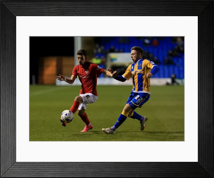 Framed Print : Battle for the Ball: Clarke vs. Lameiras in Intense Sky Bet League One Rivalry Framed Print : Battle for the Ball: Clarke vs. Lameiras in Intense Sky Bet League One Rivalry