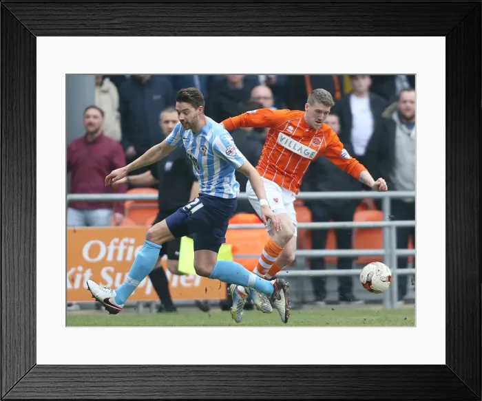 Framed Print : Jim McAlister vs Aaron Martin: A Battle in the Sky Bet League One Clash between Blackpool and Coventry City at Bloomfield Road Framed Print : Jim McAlister vs Aaron Martin: A Battle in the Sky Bet League One Clash between Blackpool and Coventry City at Bloomfield Road