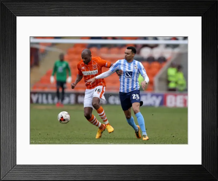 Framed Print : Battle for the Ball: Emmerson Boyce vs. Jacob Murphy in Sky Bet League One Clash Framed Print : Battle for the Ball: Emmerson Boyce vs. Jacob Murphy in Sky Bet League One Clash