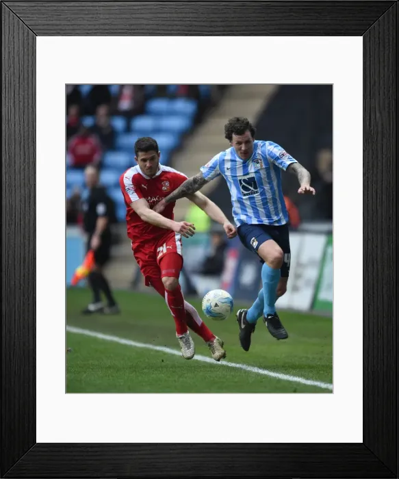Framed Print : Battle for the Ball: Coventry City vs Swindon Town in Sky Bet League One Framed Print : Battle for the Ball: Coventry City vs Swindon Town in Sky Bet League One