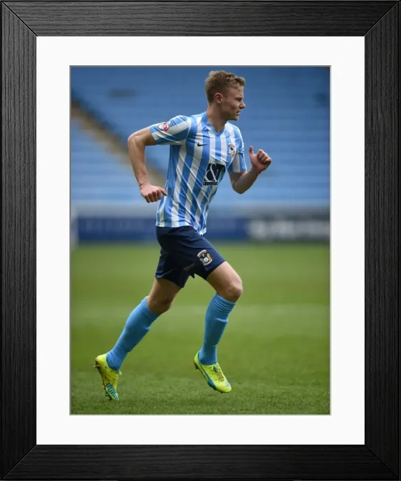 Framed Print : Andy Rose Faces Off Against Swindon Town in Sky Bet League One at Ricoh Arena