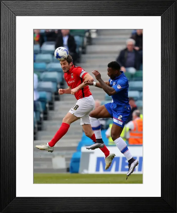 Framed Print : Sam Ricketts vs. Ryan Jackson: Intense Clash in Sky Bet League One Match at MEMS Priestfield Stadium Framed Print : Sam Ricketts vs. Ryan Jackson: Intense Clash in Sky Bet League One Match at MEMS Priestfield Stadium