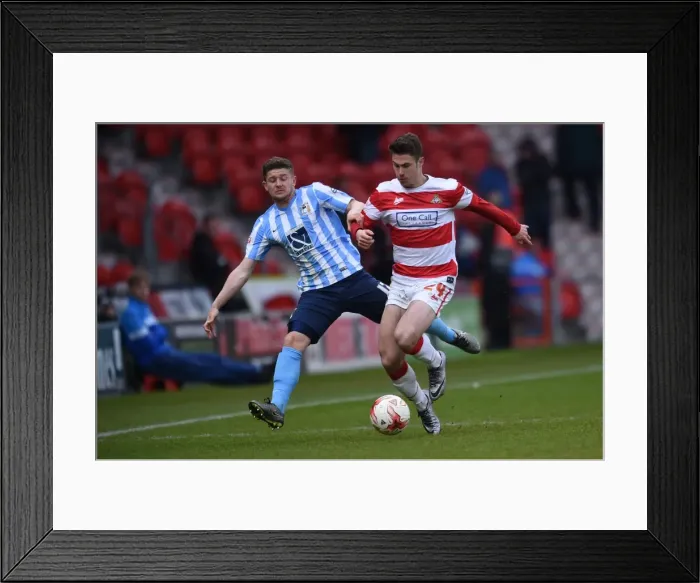 Framed Print : Tommy Rowe vs. Aaron Phillips: Intense Battle in Coventry City's Sky Bet League One Clash at Doncaster Rovers Framed Print : Tommy Rowe vs. Aaron Phillips: Intense Battle in Coventry City's Sky Bet League One Clash at Doncaster Rovers