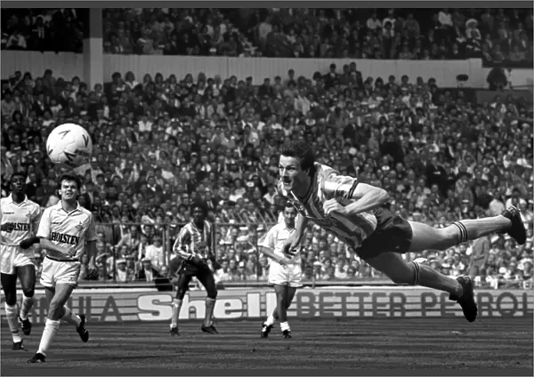 Coventry City striker Keith Houchen scores with a diving header to level the score 2-2 during the FA Cup Final against Tottenham Hotspur at Wembley
