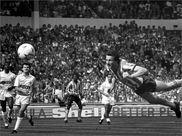 Coventry City striker Keith Houchen scores with a diving header to level the score 2-2 during the FA Cup Final against Tottenham Hotspur at Wembley