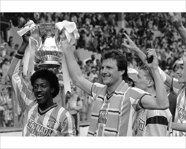 (L-R) Coventry Citys goalscorers Dave Bennett and Keith Houchen celebrate with the FA Cup after their 3-2 victory
